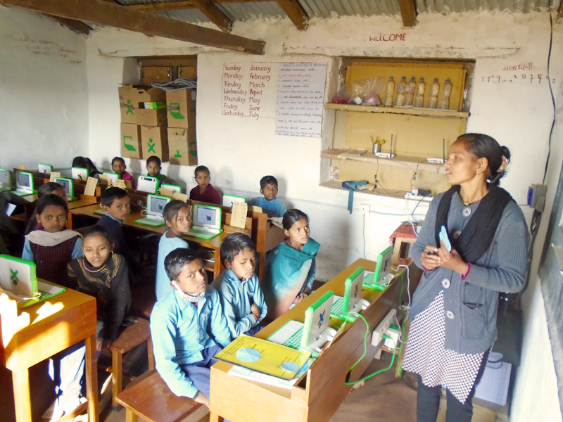 Indra conducting laptop integrated class during in-school training.