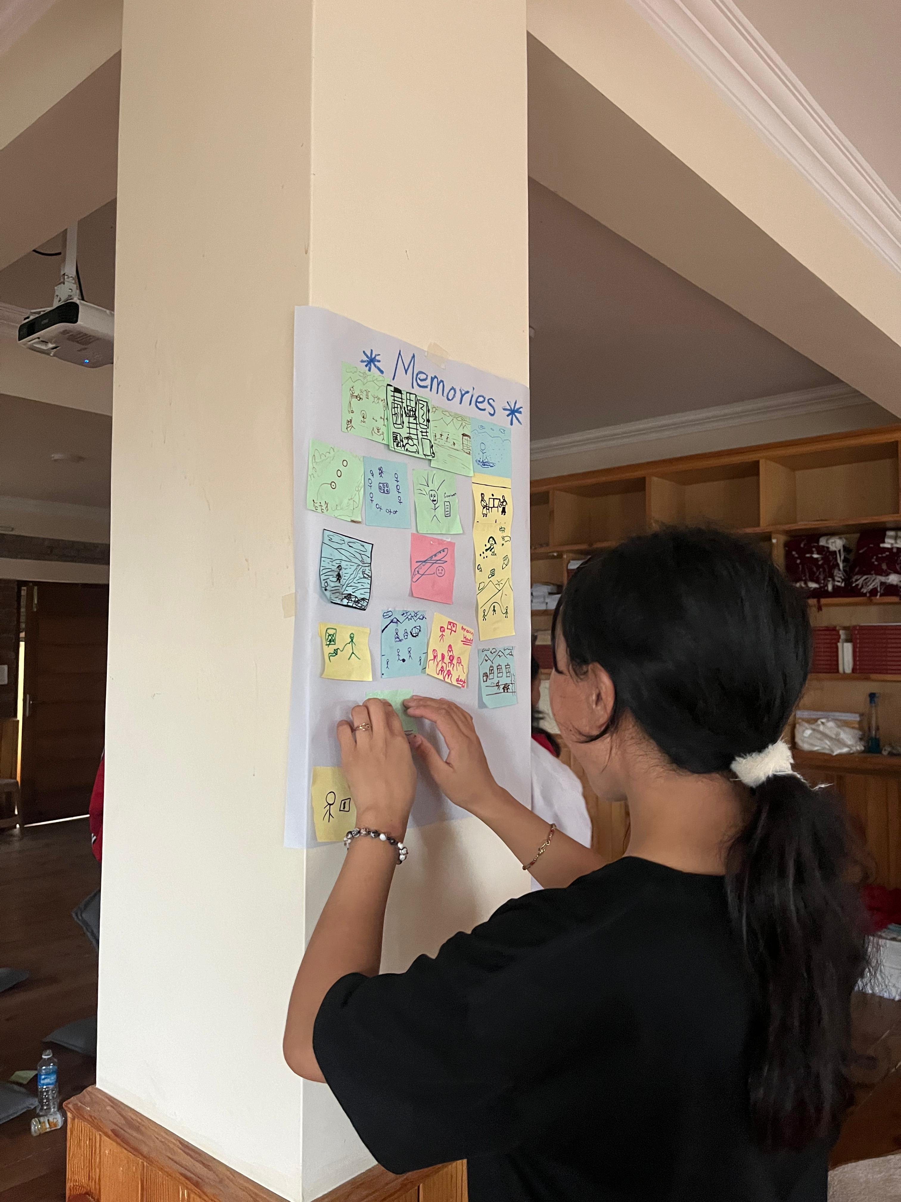student drawing at story building workshop