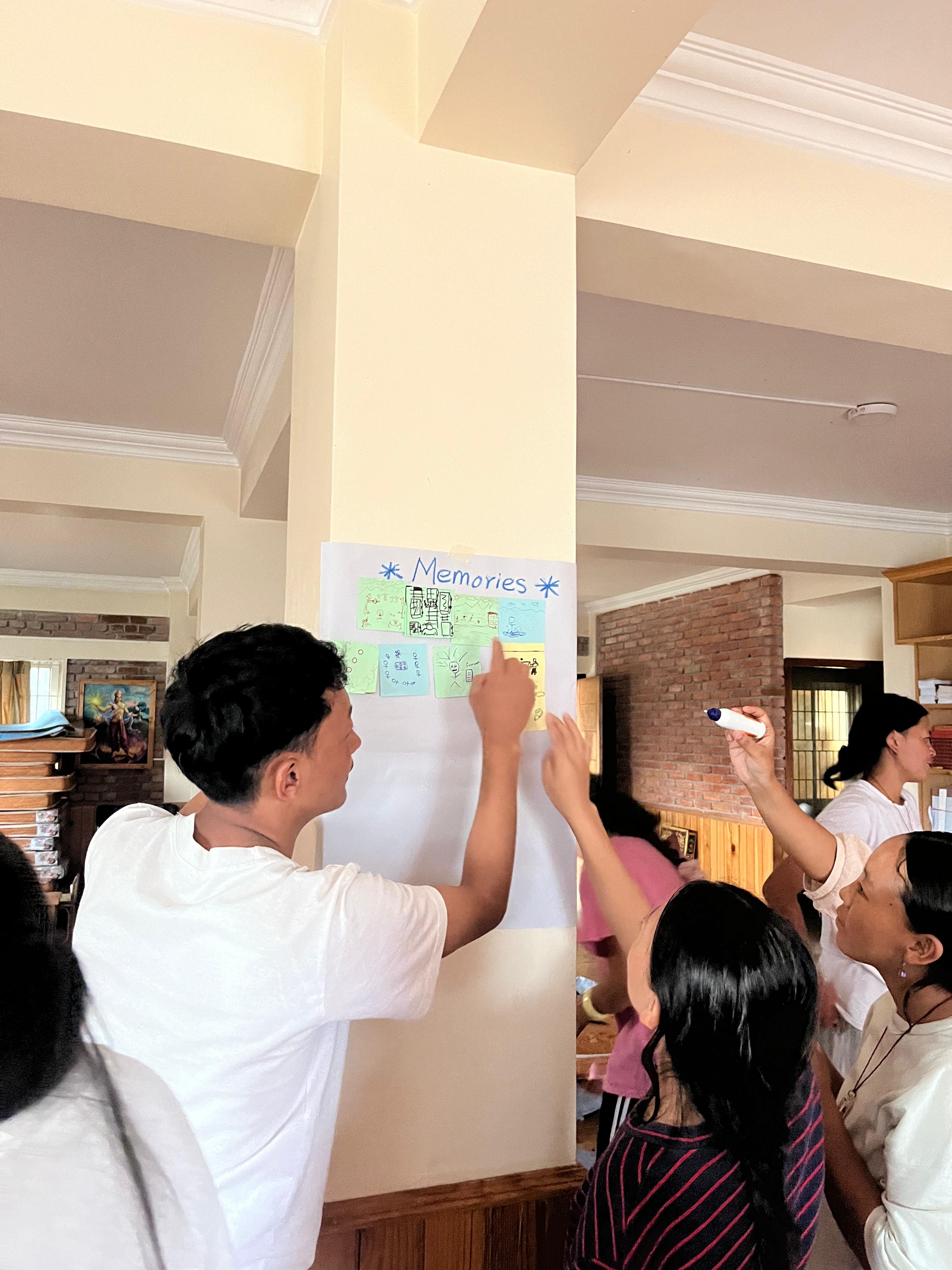 student drawing at story building workshop