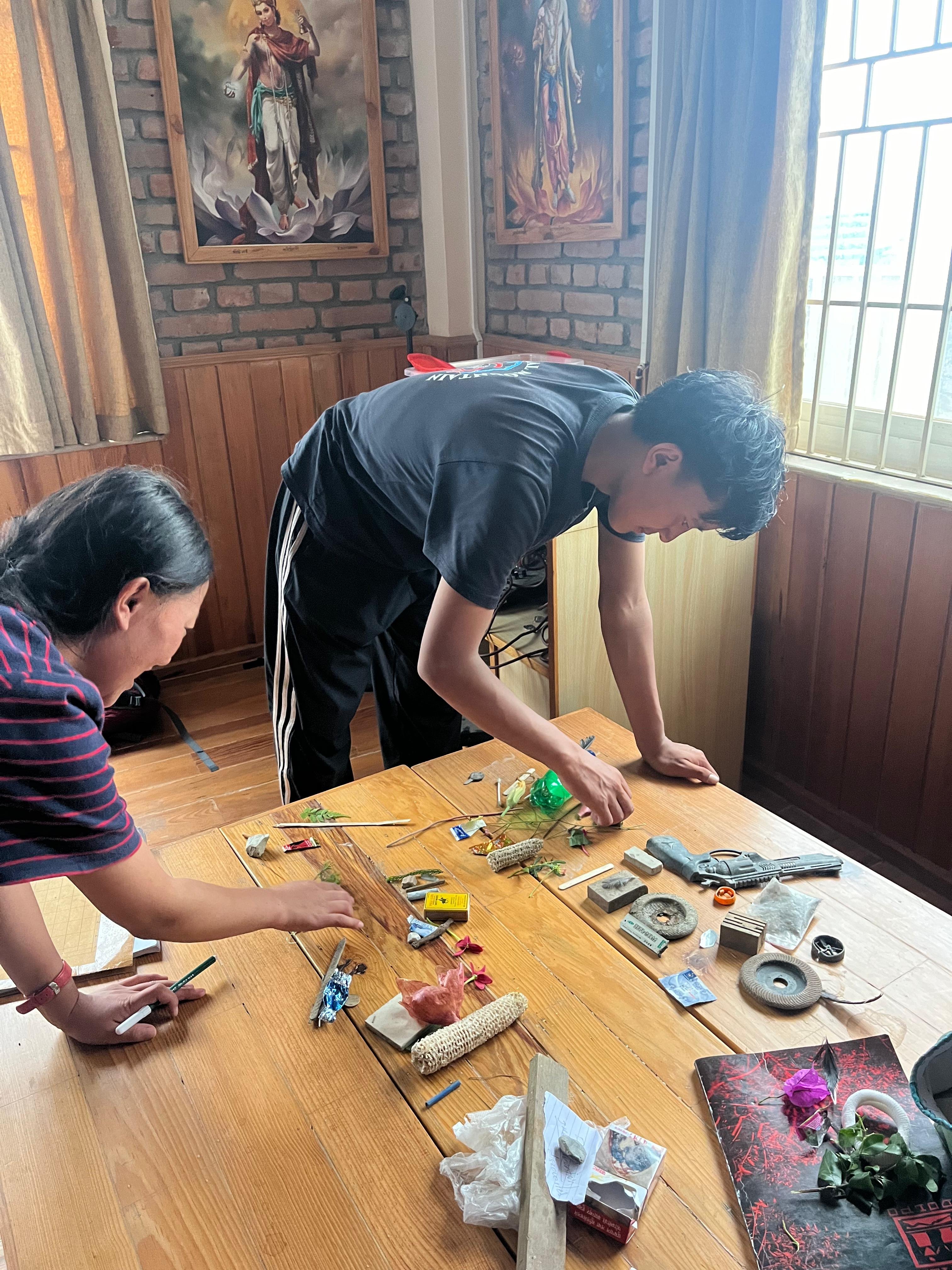 students collecting objects during story building workshop