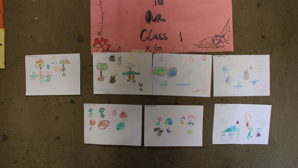 Student artwork in the classroom after drawing activity during student workshop in Kindergarten 3